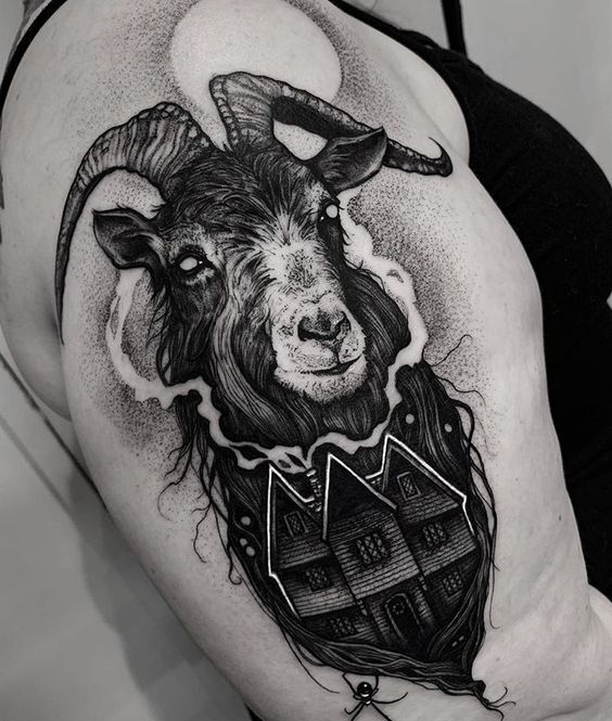Hình xăm dê phong cách blackwork trên tay, chi tiết cao, HD.