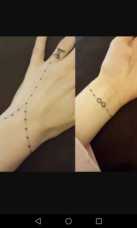 dấu vô cực dạng vòng tay Hình xăm mini trên cổ tay, phong cách blackwork với ký hiệu vô cực và họa tiết chấm, ảnh HD.