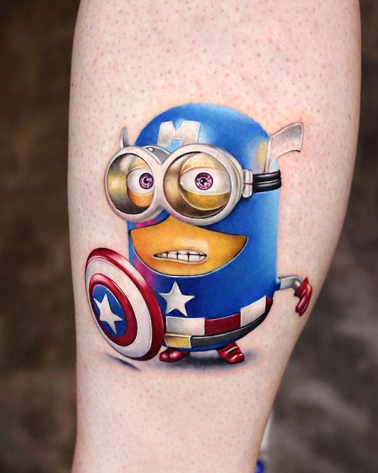 hình tattoo minion siêu giống mẫu Hình xăm nhân vật hoạt hình phong cách màu sắc trên bắp tay, chi tiết cao, độ phân giải HD.