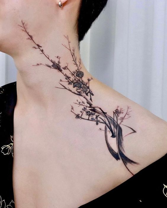 Hình xăm hoa phong cách tối giản cho phái mạnh Hình xăm cành hoa trên cổ và vai, phong cách blackwork, chi tiết tinh tế, ảnh HD.