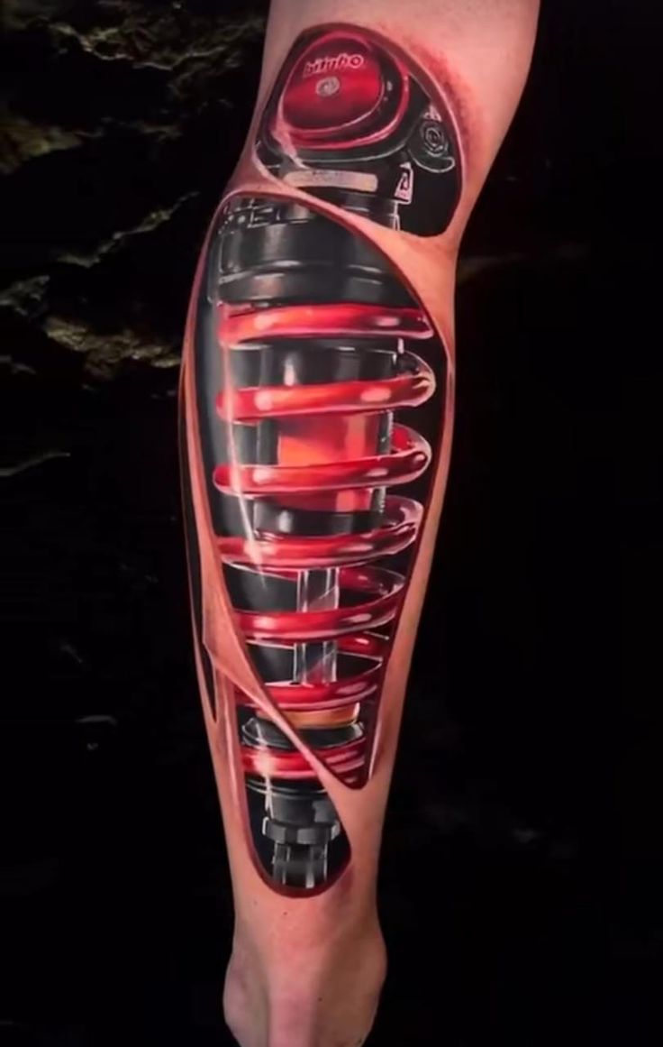 tattoo cẳng chân phuộc ohlins độc đáo Hình xăm 3D giảm xóc xe máy, vị trí bắp chân, phong cách hiện thực, chi tiết cao, độ phân giải HD.