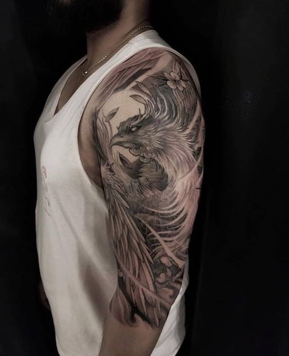Hình xăm phượng hoàng phong cách Nhật Bản Hình xăm phượng hoàng phong cách blackwork trên cánh tay, chi tiết cao, ảnh HD.