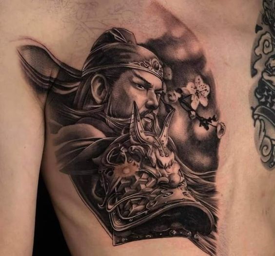 Hình xăm chân thực đơn sắc Quan Vũ Hình xăm chiến binh cổ điển trên ngực, phong cách blackwork, chi tiết sắc nét, độ phân giải cao.