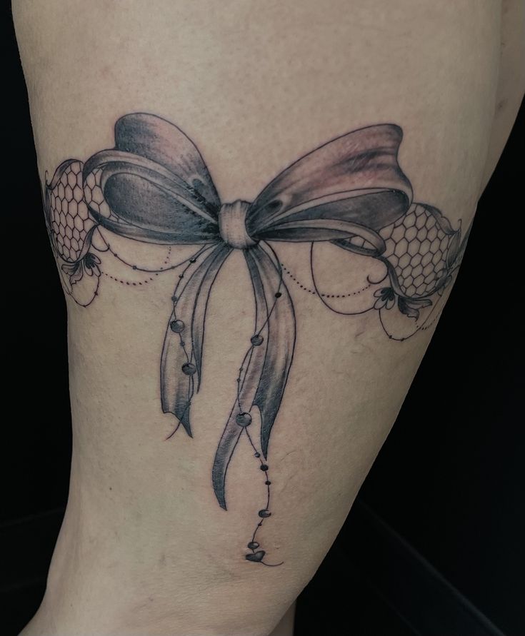 Hình xăm nơ ở đùi, mẫu thứ 5 Hình xăm nơ blackwork trên cánh tay, phong cách chi tiết, ảnh HD.