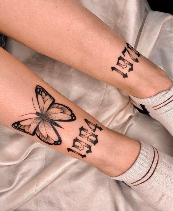 Hình xăm bướm và số năm 1984 trên chân, phong cách blackwork, chi tiết, ảnh HD.