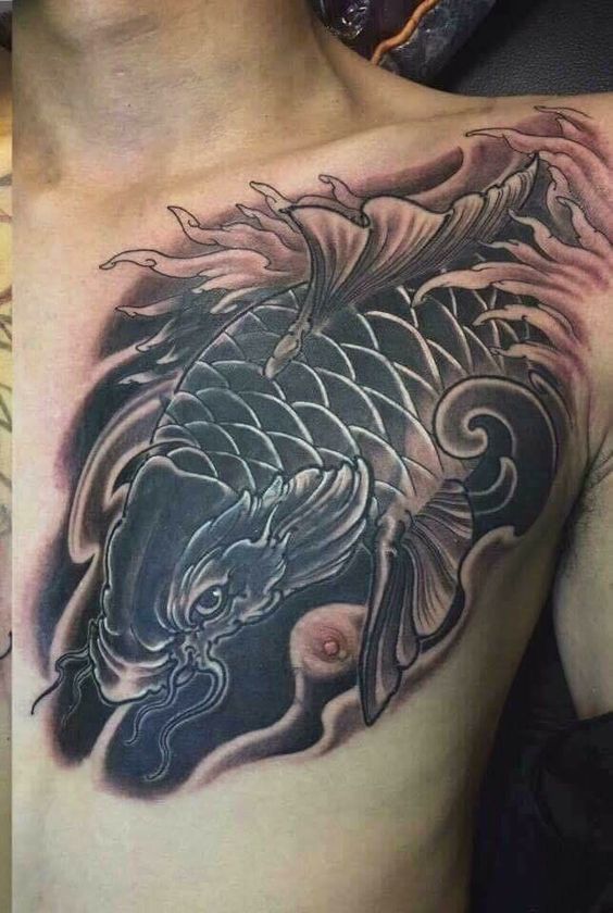 Tattoo cá chép trên ngực dành cho khách hàng ưa thích sự giản dị Hình xăm cá chép trên ngực, phong cách blackwork chi tiết, ảnh HD.