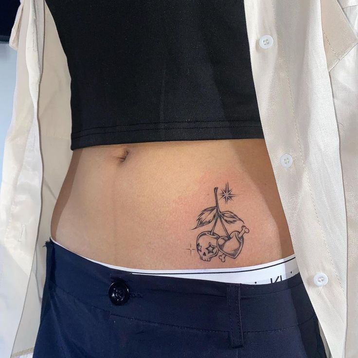 Tattoo mini ở eo cho khách Hình xăm quả anh đào phong cách blackwork trên bụng, chi tiết rõ nét, độ phân giải HD.