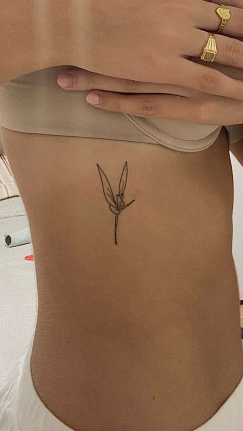 Minimalist leaf tattoo on rib, blackwork style, HD resolution.