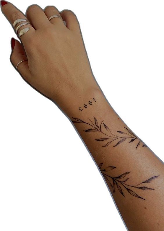 Hình xăm nhánh lá và số 1993 ở cổ tay, phong cách blackwork, chi tiết rõ nét, độ phân giải HD.